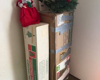 Boxed Christmas trees and other decorations
