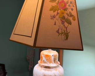 Mismatched lampshade on stone-like ceramic lamp base