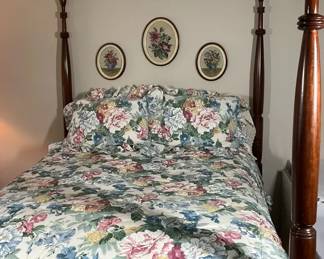 Four Poster Bed with Floral Bedding and Wall Art