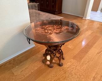 Glass top over large copper cooking pan coffee table