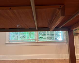 C27 - $100. Dining Table with Leaf that stores inside itself. (No chairs included)Measures 64.75" x 39" wide x 28.5" tall. Has a spot of damage to the veneer in the center - see photos.