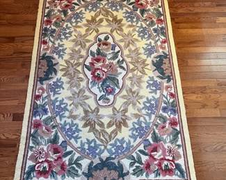 C24 - $200. Set of 3 Hooked Rugs from Petit Point (MER). 100% wool. Largest measures 66" x 43". 2 Smaller measures 47" x 30".