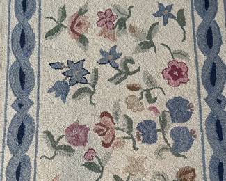 C22 - $60. Hooked Area Rug. Measures 60" x 37".