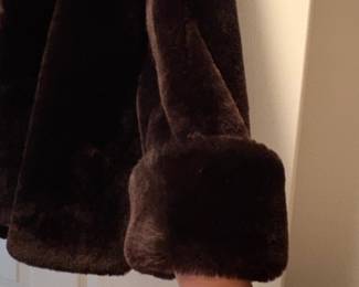 C48 - $95. Vintage Sheared Fur (Beaver?) Swing Coat. Has 2 hook closures , hidden pockets and is in Excellent Condition. Measures 28" long down the middle back x 18" shoulder to shoulder.