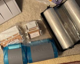 C64 - $20. Xyron 850 Laminating System. Has laminating paper loaded, an extra cartridge and a 2" & 4" adhesive runner with refills.