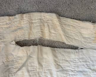 C71 - $50. Antique Quilt - probably a cutter. Measures 84" x 99". Has holes and wear throughout.
