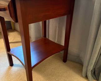 C54 - $40. Solid Wood Side Table in good condition. Has a scratched area on the top towards the front. Measures 17.5" x 22" deep x 27" tall.