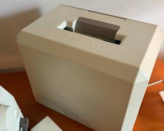 C58 - $400. Bernina 1130 Sewing Machine. Turns on and pedal works! Comes with 5 instruction booklets and cover.