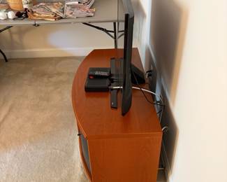 C35 - $40. Media Cabinet with 4 doors on the front. (That's a 40" TV on it)