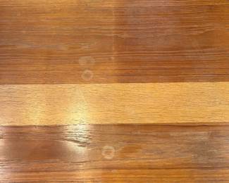C27 - $100. Dining Table with Leaf that stores inside itself. (No chairs included)Measures 64.75" x 39" wide x 28.5" tall. Has a spot of damage to the veneer in the center - see photos.