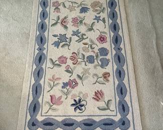 C22 - $60. Hooked Area Rug. Measures 60" x 37".