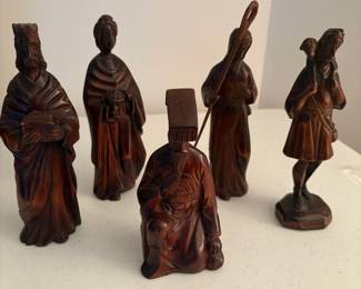 C65 - $60. Carved wood nativity from South Korea. 15pc. Lamb & Donkey need easy repairs. Measures 12" tall. 3 sheep were added but very similar wood.