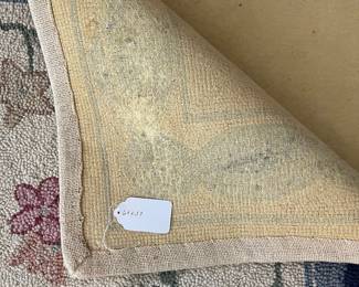 C22 - $60. Hooked Area Rug. Measures 60" x 37".