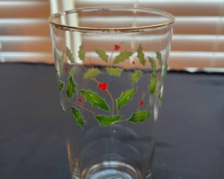 C104 - $110. Lenox Holiday China Set. 12 - 8" plates. 12 - drinking glasses. 1 cookie jar, vase, serving bowl, serving plate, 11.75" serving plate, 10.5" serving plate, 8" serving plate, 1 candle holder.