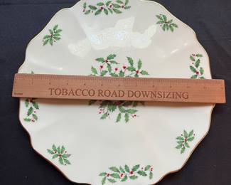 C104 - $110. Lenox Holiday China Set. 12 - 8" plates. 12 - drinking glasses. 1 cookie jar, vase, serving bowl, serving plate, 11.75" serving plate, 10.5" serving plate, 8" serving plate, 1 candle holder.