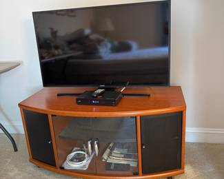 C35 - $40. Media Cabinet with 4 doors on the front. (That's a 40" TV on it)