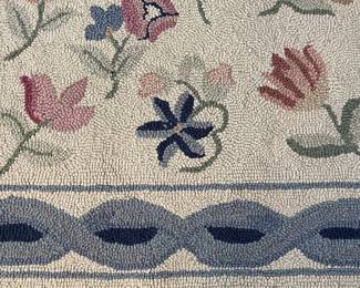 C22 - $60. Hooked Area Rug. Measures 60" x 37".