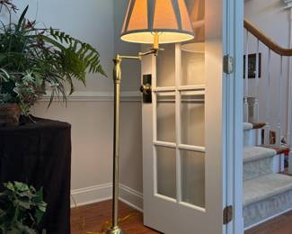 C92 - $75. Swing Arm Brass Floor Lamp. Measures 60" tall.
