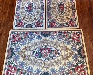 C24 - $200. Set of 3 Hooked Rugs from Petit Point (MER). 100% wool. Largest measures 66" x 43". 2 Smaller measures 47" x 30".