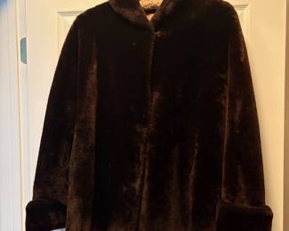 C48 - $95. Vintage Sheared Fur (Beaver?) Swing Coat. Has 2 hook closures , hidden pockets and is in Excellent Condition. Measures 28" long down the middle back x 18" shoulder to shoulder.