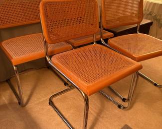 C125 - $200. Breuer Cane Cesca Cantilever Chairs. set of 4 with rounded fronts. 18" seat height, 31" total height. Very good overall condition - 1 seat has minor breakage - 1 chair has scratches on the front.