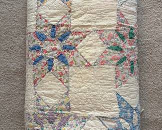 C71 - $50. Antique Quilt - probably a cutter. Measures 84" x 99". Has holes and wear throughout.