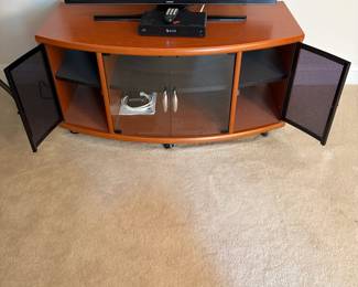 C35 - $40. Media Cabinet with 4 doors on the front. (That's a 40" TV on it)