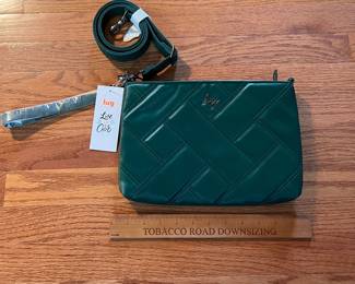 C107 - $20. Lug Convertible Cross Body Bag. Waltz-Wickedly Green. Measures 11.25" x 7.5".
