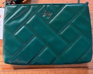 C107 - $20. Lug Convertible Cross Body Bag. Waltz-Wickedly Green. Measures 11.25" x 7.5".