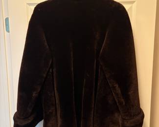C48 - $95. Vintage Sheared Fur (Beaver?) Swing Coat. Has 2 hook closures , hidden pockets and is in Excellent Condition. Measures 28" long down the middle back x 18" shoulder to shoulder.