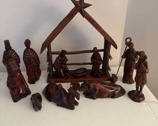 C65 - $60. Carved wood nativity from South Korea. 15pc. Lamb & Donkey need easy repairs. Measures 12" tall. 3 sheep were added but very similar wood.