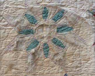 C71 - $50. Antique Quilt - probably a cutter. Measures 84" x 99". Has holes and wear throughout.