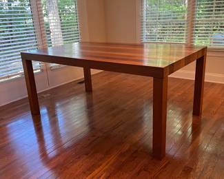 C27 - $100. Dining Table with Leaf that stores inside itself. (No chairs included)Measures 64.75" x 39" wide x 28.5" tall. Has a spot of damage to the veneer in the center - see photos.