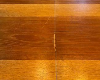 C27 - $100. Dining Table with Leaf that stores inside itself. (No chairs included)Measures 64.75" x 39" wide x 28.5" tall. Has a spot of damage to the veneer in the center - see photos.