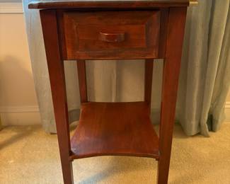 C54 - $40. Solid Wood Side Table in good condition. Has a scratched area on the top towards the front. Measures 17.5" x 22" deep x 27" tall.
