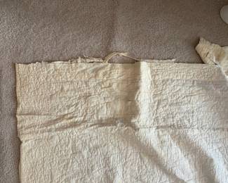 C71 - $50. Antique Quilt - probably a cutter. Measures 84" x 99". Has holes and wear throughout.