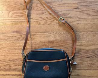 C10 - $45. Vintage Y2K Dooney & Bourke Camera Bag. Crossbody, Black Pebble Leather. Measures 10" x 3" x 7".