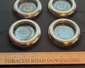 C106 - $25. Set of 4 Sterling Coasters.