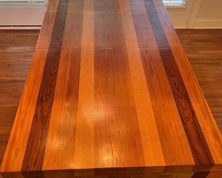 C27 - $100. Dining Table with Leaf that stores inside itself. (No chairs included)Measures 64.75" x 39" wide x 28.5" tall. Has a spot of damage to the veneer in the center - see photos.