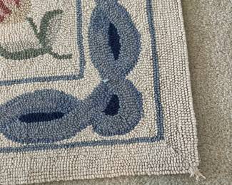 C22 - $60. Hooked Area Rug. Measures 60" x 37".