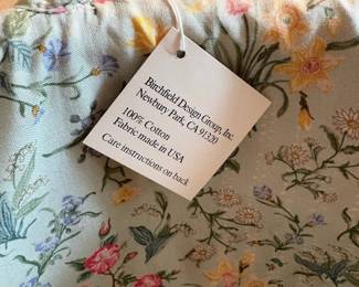 C63 - $60. Pair of Claire Murray Nantucket Style Market Baskets with floral fabric liner & handles. Large basket is 14" x 7.5". Smaller is 11" x 5.5" tall.