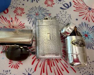 Foldable sunglasses in cases. Lighter with cigarette holder