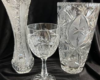 Czech crystal 11"H vase,  $55.  Pinwheel star crystal goblet,  $15.  Glass intricate detailed vase, 10"H,  $28