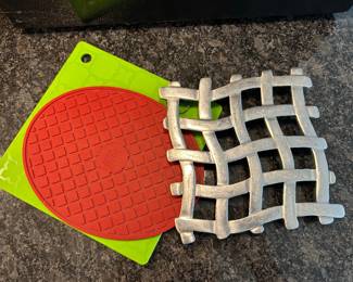 Trivets, silicone - $3 each.  Metal trivet,  $4