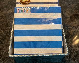Silver cocktail napkin holder,  $4.  Navy blue and bright blue cocktail napkins,  $2 each