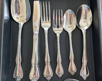 11 Place Settings Oneida flatware,  $35