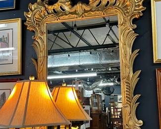 Large ornate gold tone mirror
