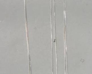 Lot # : 337 - Three sterling silver chains one with rhinestone pendant