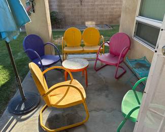 Colorful vintage patio chair set with matching table