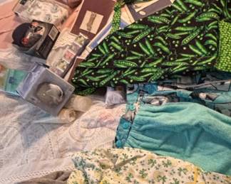Aprons with Pea Pod and Floral Motifs and Beauty Care Products